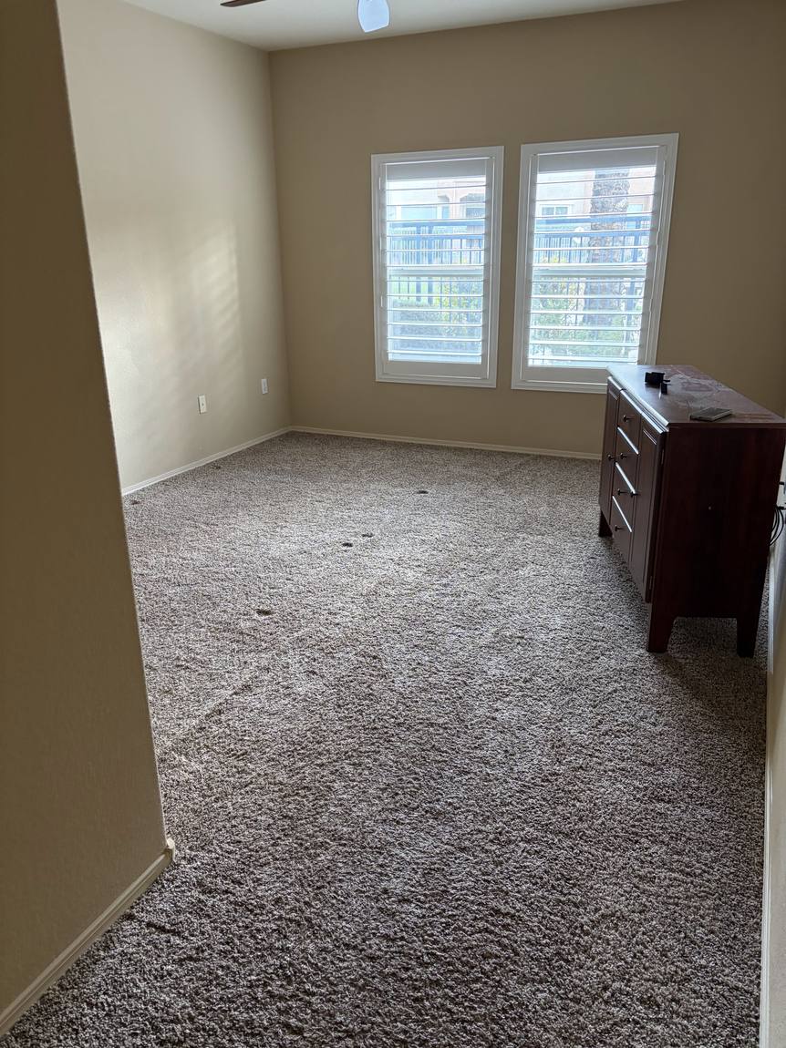 Carpet to LVT: Bedroom before remodel